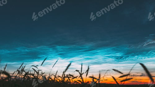 Preview: 4K Night Starry Sky With Glowing Stars Above Countryside Landscape. Noctilucent Clouds Above Rural