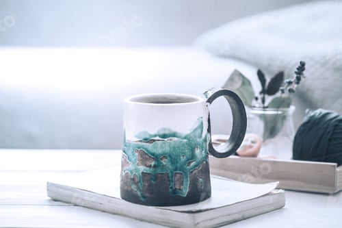 Preview: book and a cup of tea on a wooden background