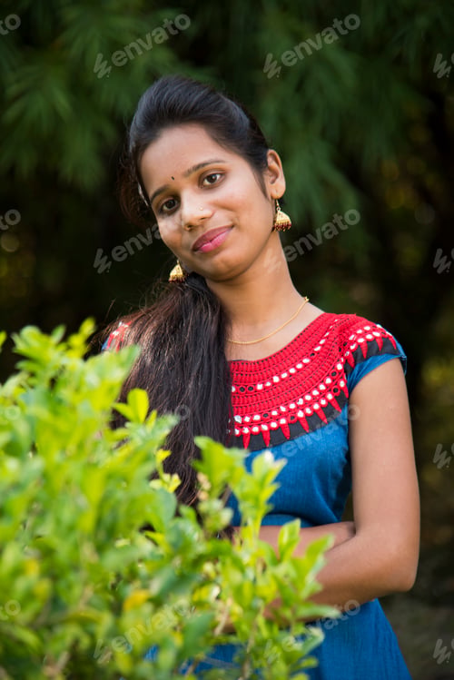 Preview: Outdoor portrait of beautiful young Indian girl in the park