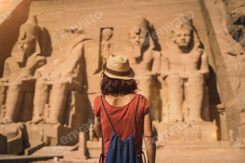 Preview: A young tourist in a red dress entering the Abu Simbel Temple in southern Egypt