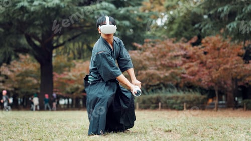 Preview: Virtual reality, park and Asian man with controller for martial arts, Kendo practice and exercise.