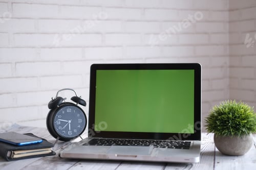 Preview: laptop with blank screen on office desk.