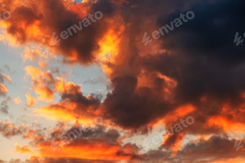 Preview: Dramatic sky in summer sunset with vibrant clouds