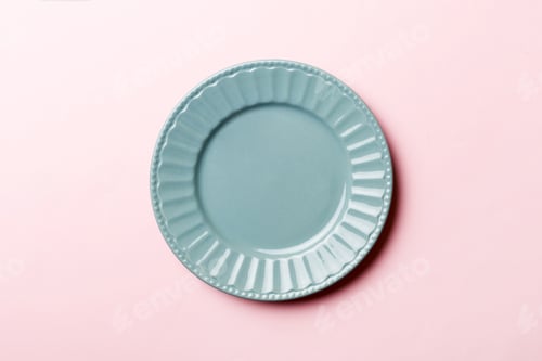 Preview: Top view of isolated of colored background empty round blue plate for food.