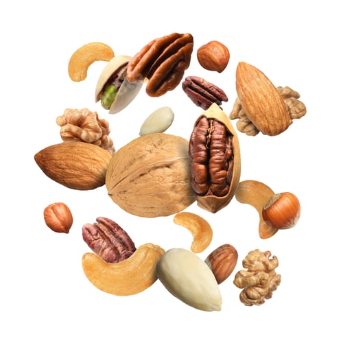 Preview: Pecan and other nuts in air on white background