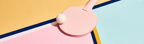 Preview: Pink ping pong racket and ball on abstract background with blue lines, panoramic shot