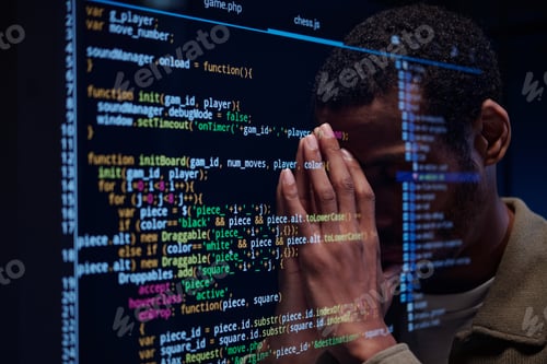 Preview: Stressed Developer Reviewing Complex Code on Screen