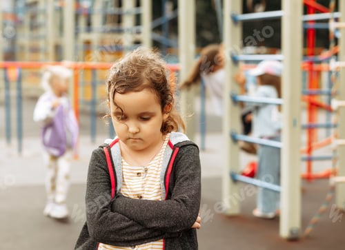 Preview: Upset lonely bullied little kid girl looking away feels abandoned abused, sad alone preschool child