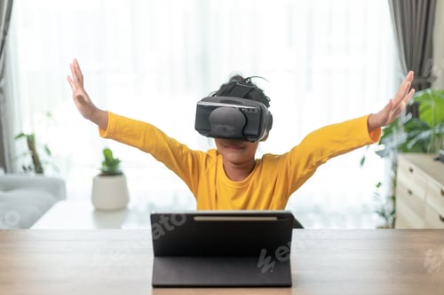 Preview: Cute girl wearing virtual reality googles at home, remote education experiment, future today,