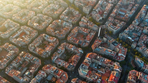 Preview: Barcelona city skyline, aerial view. Eixample residential district at sunset