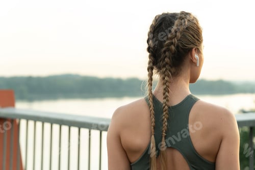 Preview: Woman athlete during her outdoor fitness workout