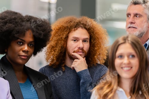 Preview: Team members pondering in a modern office.