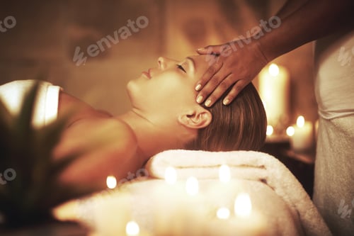 Preview: Life is better at the spa. Closeup shot of a young woman enjoying a head massage at the spa.
