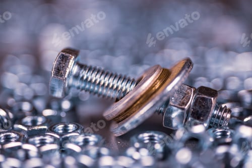 Preview: Metal chrome bolts and nuts in a chaotic order industrial background