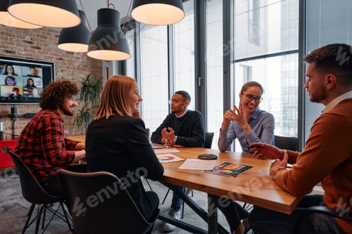 Preview: In the vibrant ambiance of a modern startup office, a diverse team of business professionals engage