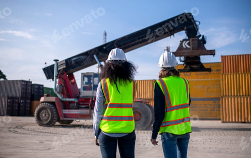 Preview: Engineer or dockworker working in the construction container dock yard checking and inspection conta