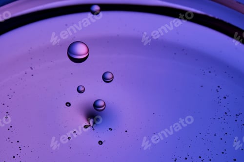 Preview: The texture of a serum or cosmetic oil with drops.