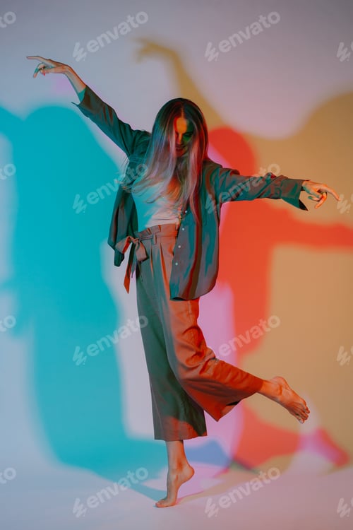 Preview: Woman expressing emotion with body language in colored light