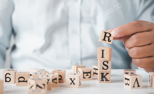 Preview: Hand hold wooden block with the word "RISK". Concept risk