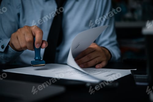Preview: Hand man stamping documents notary public in office .