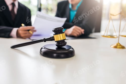 Preview: Team of lawyers man working together on legal matters in the office.