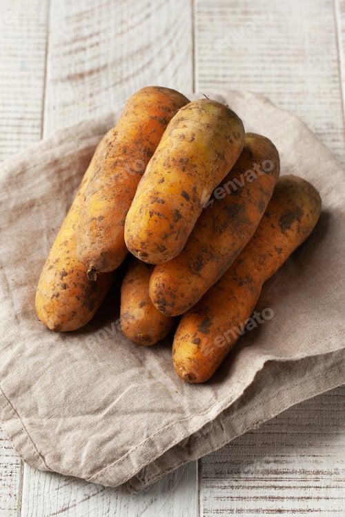 Preview: Fresh Carrots on a Rustic Linen Napkin