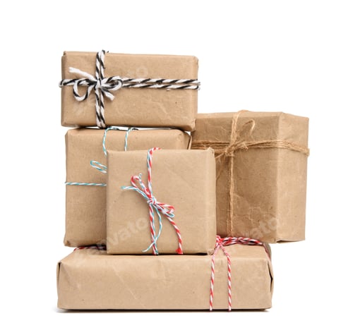 Preview: Big stack of gifts wrapped in brown kraft paper and tied with rope