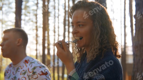 Preview: Friends eat delicious fresh food in nature. Stock footage. Friends have fun relaxing in nature and