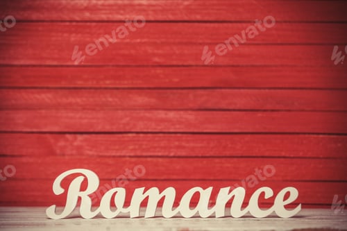 Preview: wooden word Romance on red background.