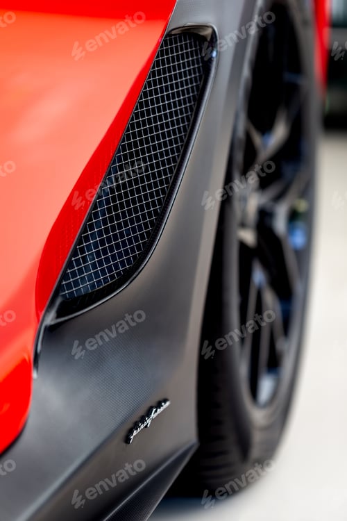 Preview: Luxury red car closeup details. Fancy Ferrari front.