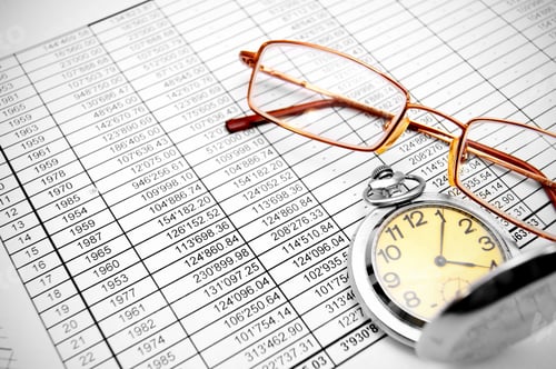Preview: Watch and glasses on documents.