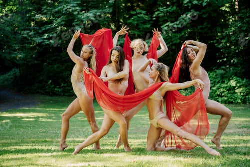 Preview: Five dancers perform outdoors with a red fabric