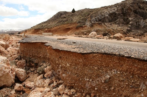 Preview: Damaged mountain asphalt road. Country road.