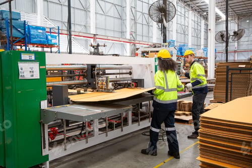 Preview: Industrial factory workers working in metal manufacturing industry.