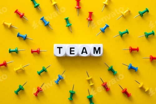 Preview: Color push pins with their spike pointed to the block with TEAM word. Business Conceptual
