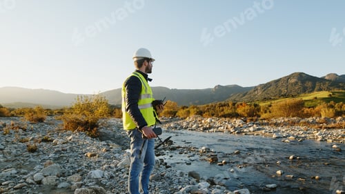 Preview: engineer with drone controls the territory