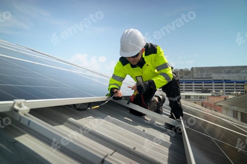 Preview: Technician installing solar panels on a rooftop in sunny weather