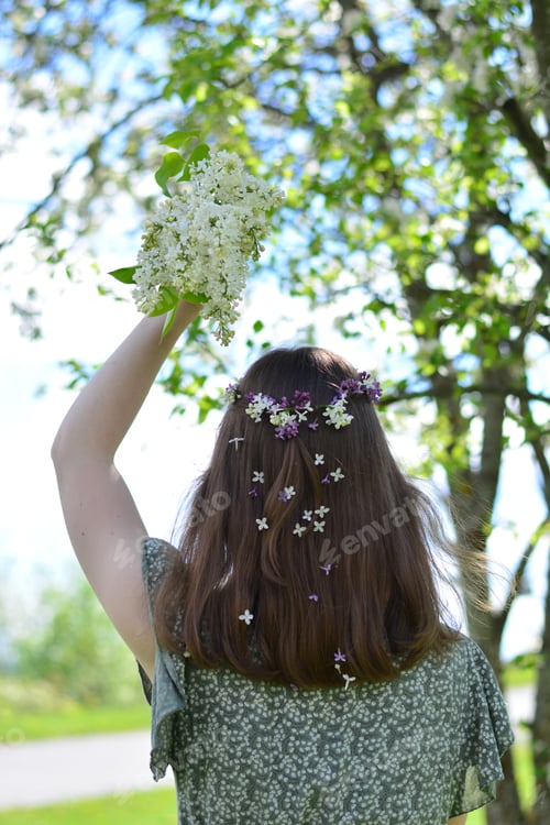 Preview: Woman with Flowers in Her Hair Outdoors