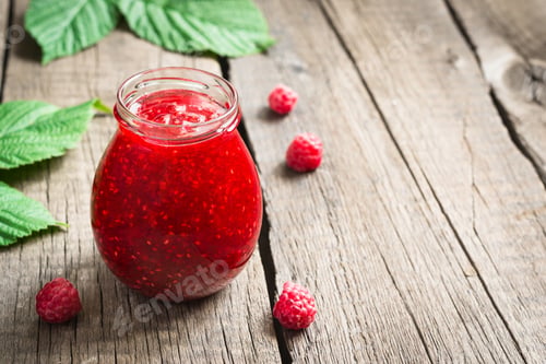 Preview: Jar with homemade raspberry jam. Ripe Berries and Leaves, copy space