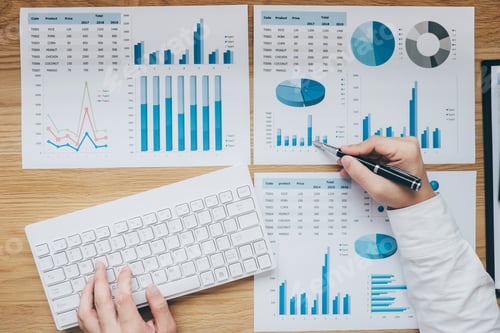 Preview: Businessman working on a graph document financial report and analysis calculation cost with