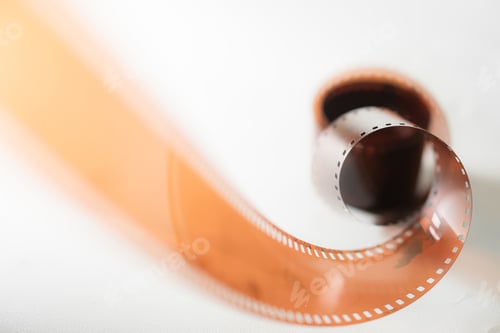 Preview: Curled Film Strip with Dark Container