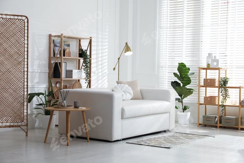 Preview: Stylish shelving unit with decor and sofa in room