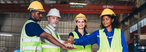 Preview: Team engineers and foreman stack hand and shake hands to show success at factory machines.