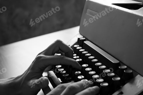 Preview: Close up of Male hands typing on the old typewriter. Black and White tone