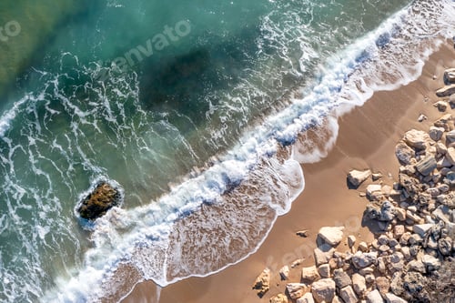 Preview: Aerial drone overhead view of beautiful wave splash on a rocky cost