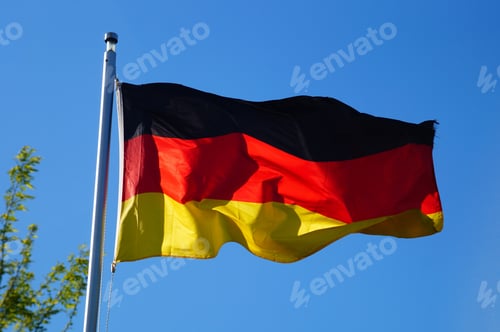 Preview: The German flag flies in the evening light.