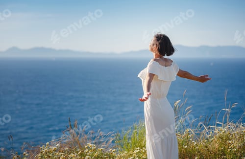 Preview: Beautiful Asian young woman in white dress outdoor