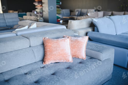 Preview: Sofa showroom displaying modern furniture with decorative pillows