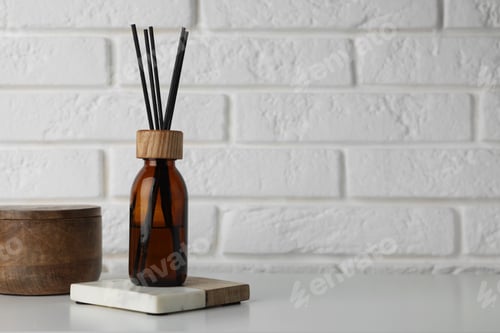 Preview: Air reed freshener on table against white wall. Space for text