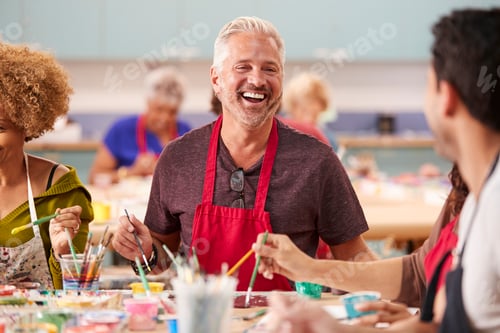Preview: Group Of Mature Adults Attending Art Class In Community Centre